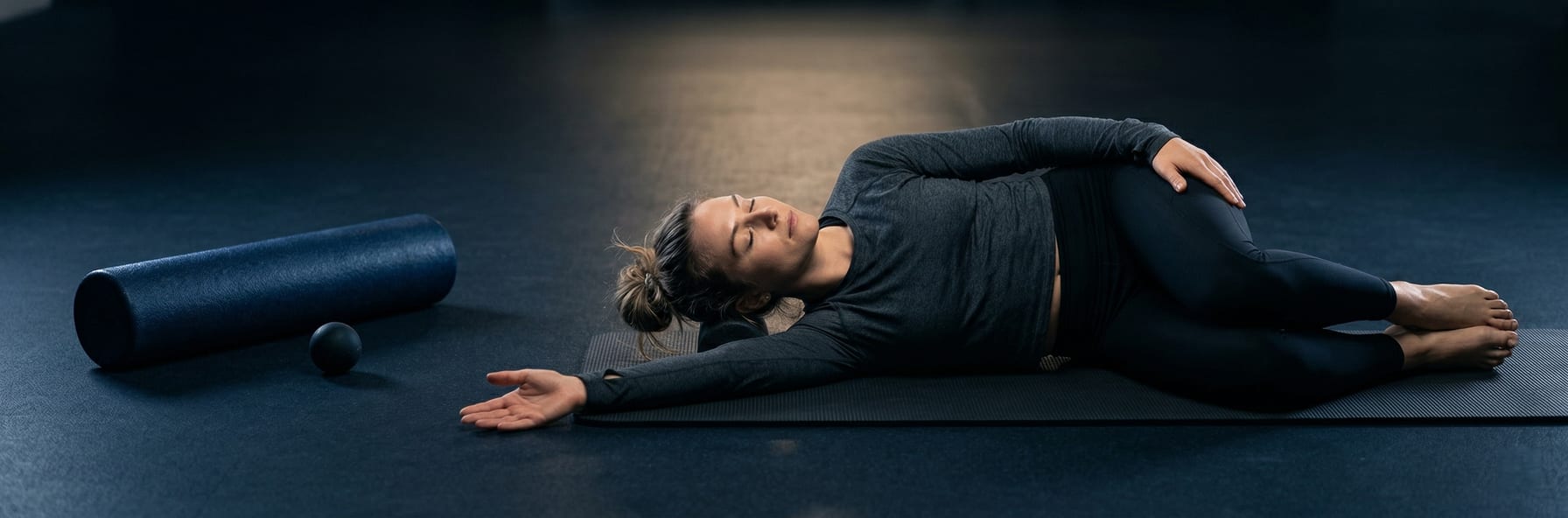 Recovery essentials — foam roller, sleep mask, water bottle, and stretching silhouette in cool blue tones